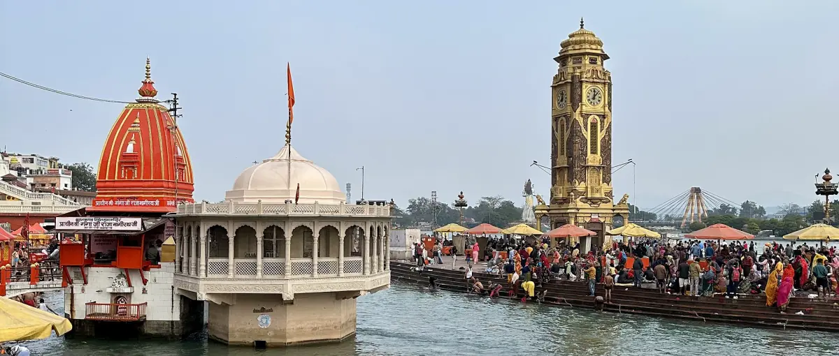 Har Ki Pauri ghat with clock tower and temple on the Ganges at Haridwar
