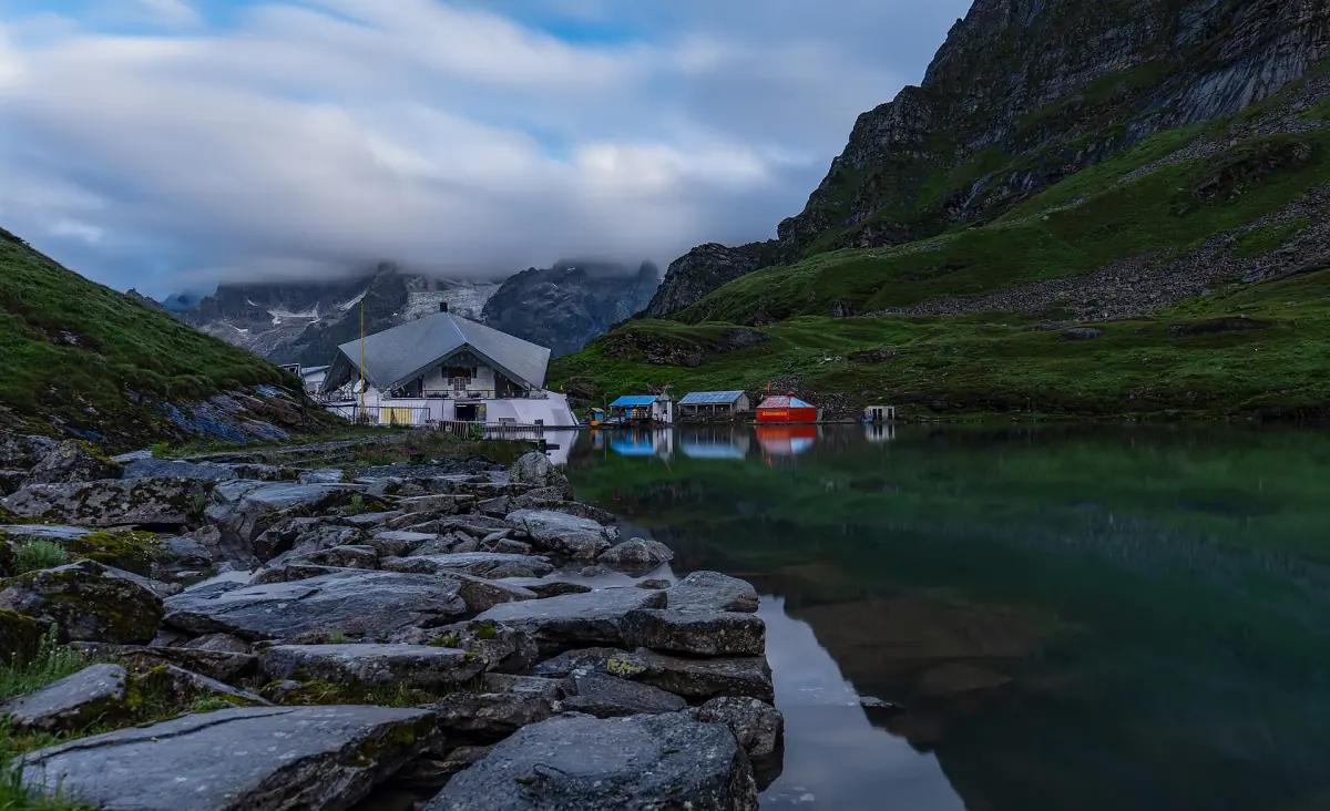 Hemkund Sahib shrine beside the green Lokpal Lake among mountains