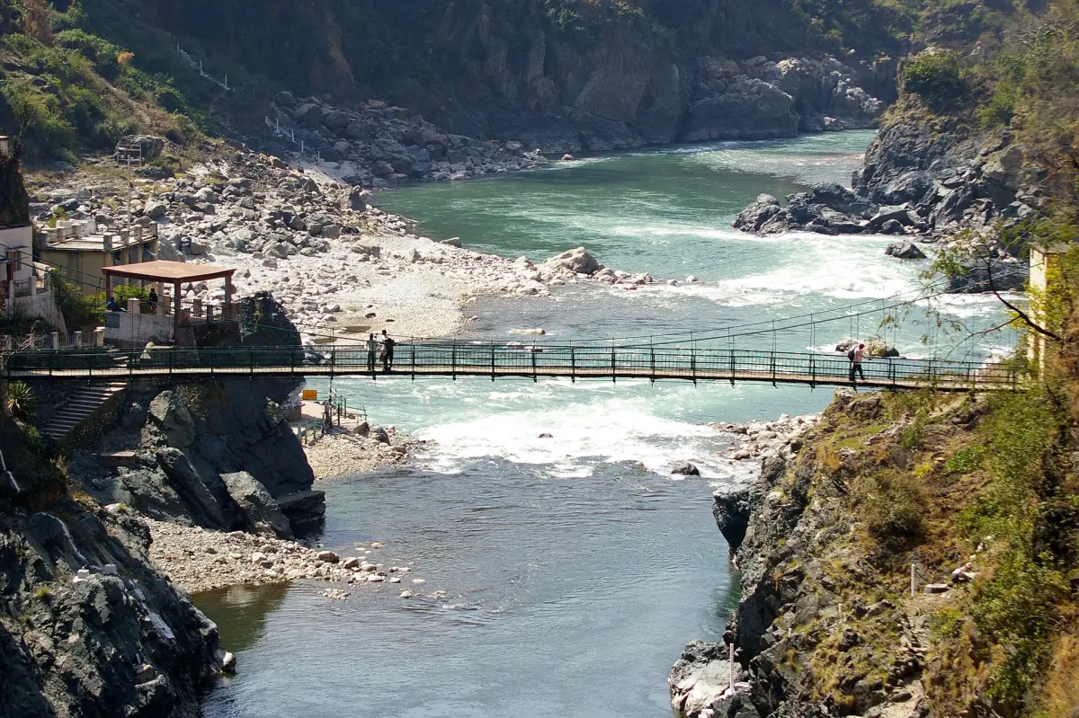 Alaknanda and Mandakini meeting in a gorge with a footbridge